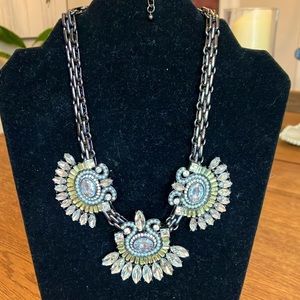 Dark Crome necklace with light green and white stones in new condition